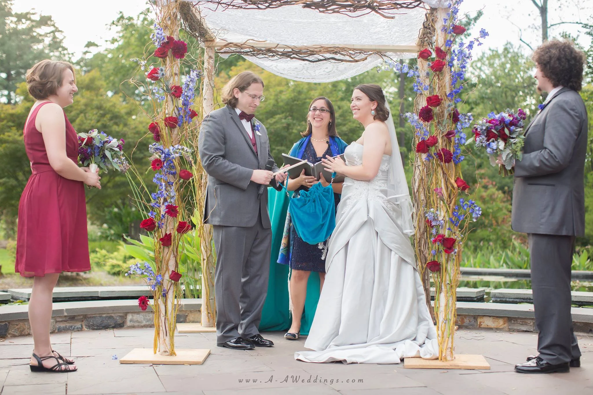 The chuppah, along with us holding our kinyan bag, and me a slide rule